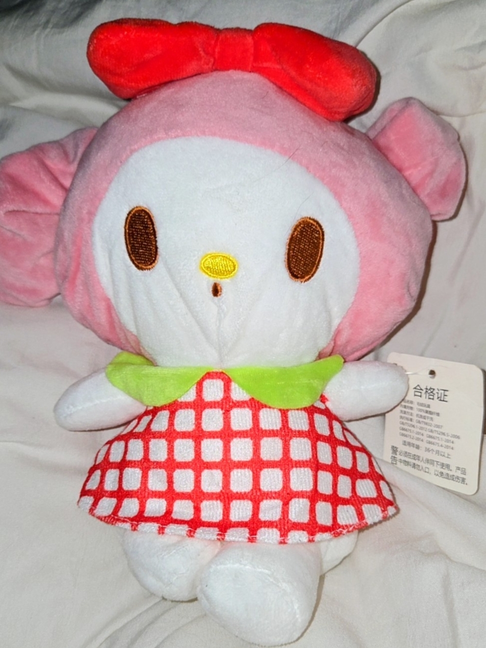 Sanrio Pink Plush Doll with Red Bow and Checkered Dress